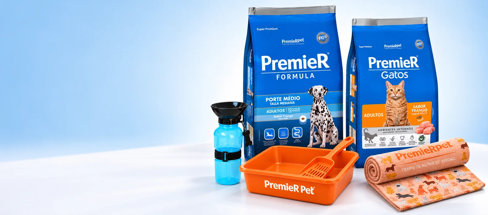 Bolsas de PremieR para perro y gato con botella bebedero, bandeja sanitaria y manta de regalo.